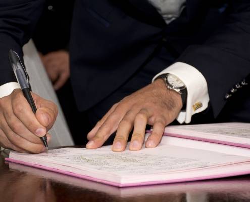 businessman filling out paperwork