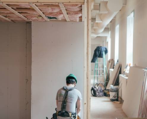 Construction worker in unfinished home