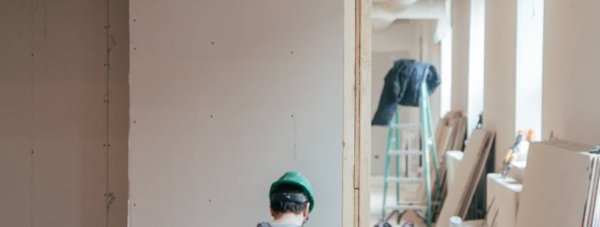 Construction worker in unfinished home