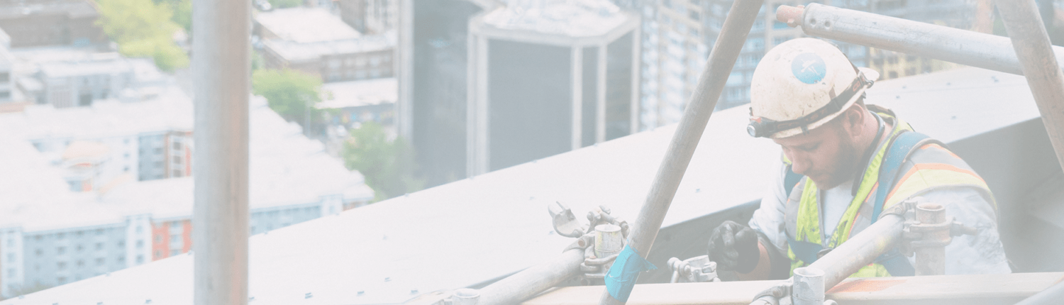 construction worker on top of building