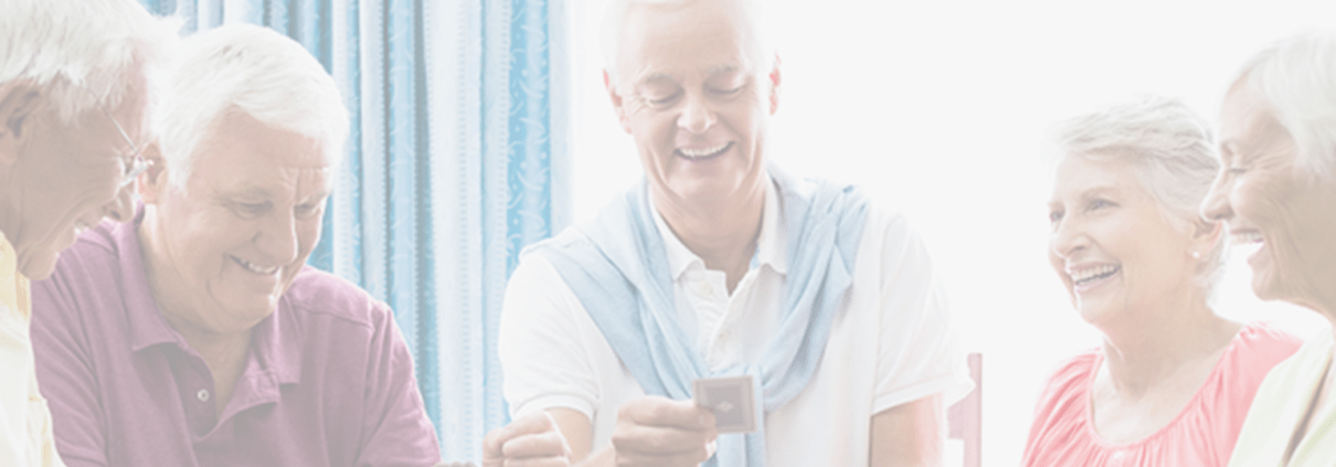 elderly people playing cards